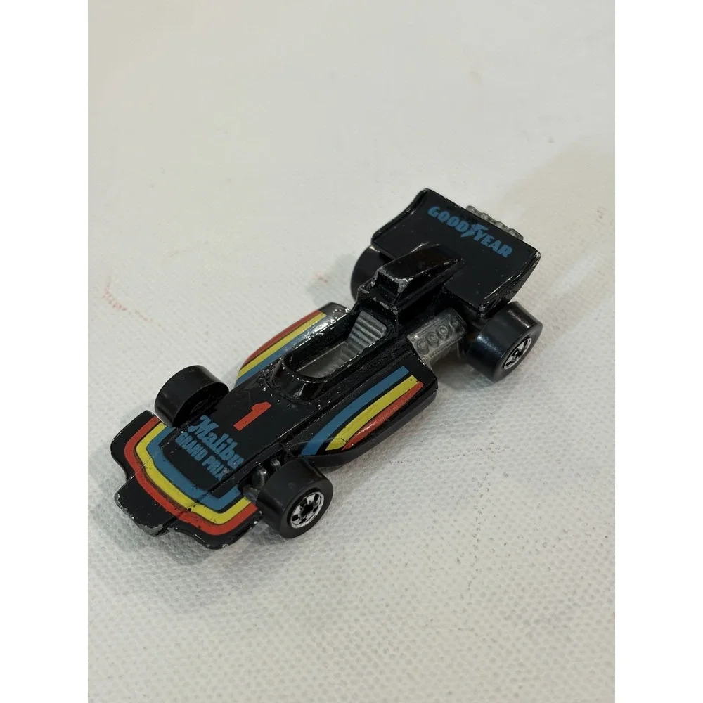 1982 Hot Wheels Malibu Grand Prix 1973 Malaysia Blackwalls Metal Base Black #1